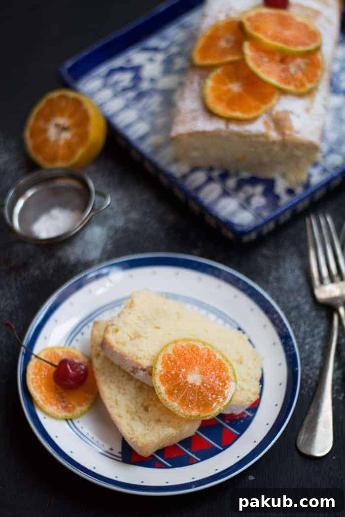 Perfectly cut slices of orange pound cake, garnished and served on a plate, ready to be savored.