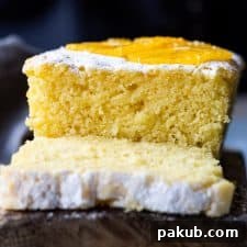 Close up of orange buttermilk pound cake crumb, indicating moisture.