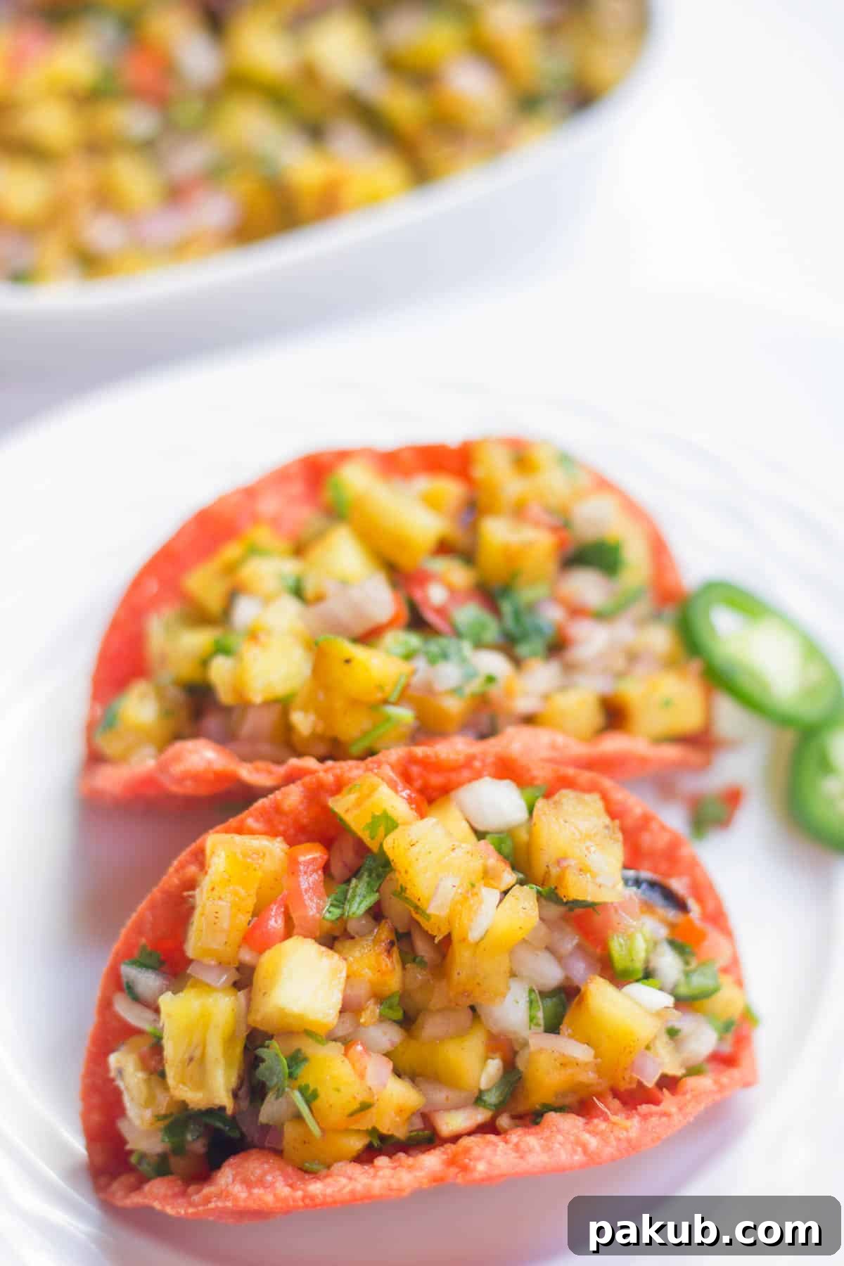 Grilled Pineapple Habanero Salsa 3 Spicy Grilled Pineapple Salsa served in colorful beet tacos, garnished with fresh cilantro.