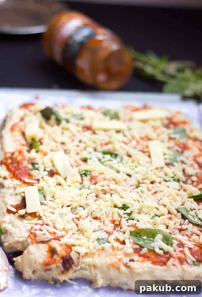 Pizza Bread with Generous Cheese Layer Step by step image of pizza bread with cheese added