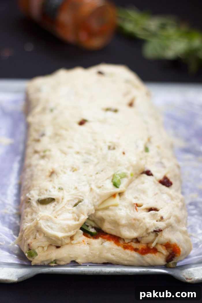 Pizza Bread Dough Rolled Letter Style Step by step image of pizza bread being rolled up letter style