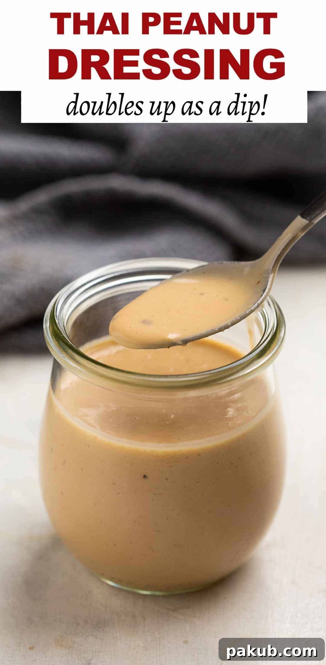 Three Game-Changing Salad Dressings for Your Kitchen 3 Thai Peanut sauce in a jar with a spoon being taken out