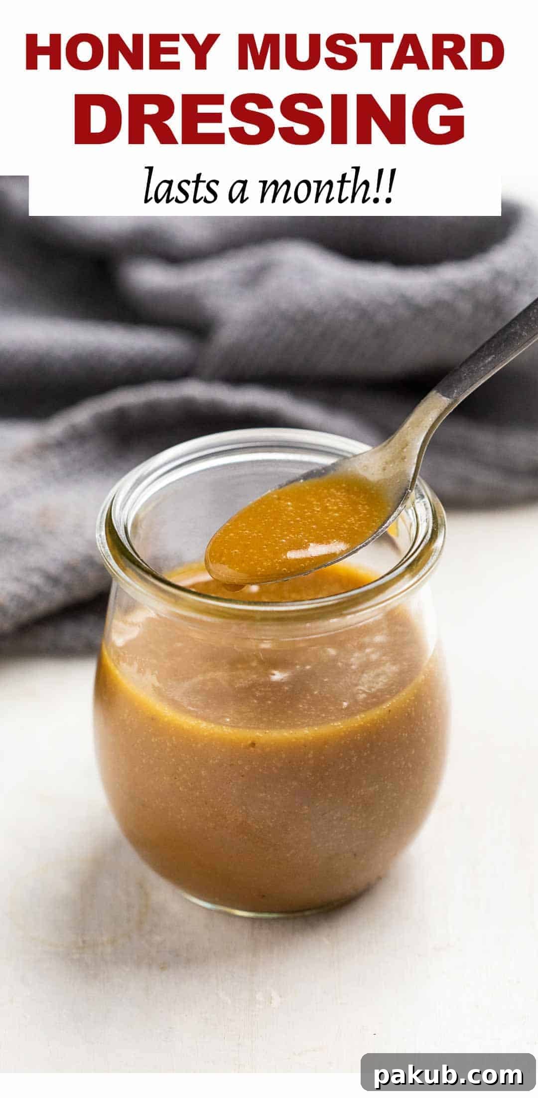 Three Game-Changing Salad Dressings for Your Kitchen 4 Honey mustard in a jar with a spoon being taken out