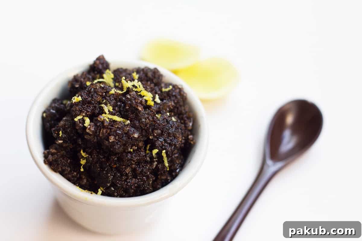 A beautifully arranged white bowl filled with DIY Homemade Coffee Scrub, ready for use.