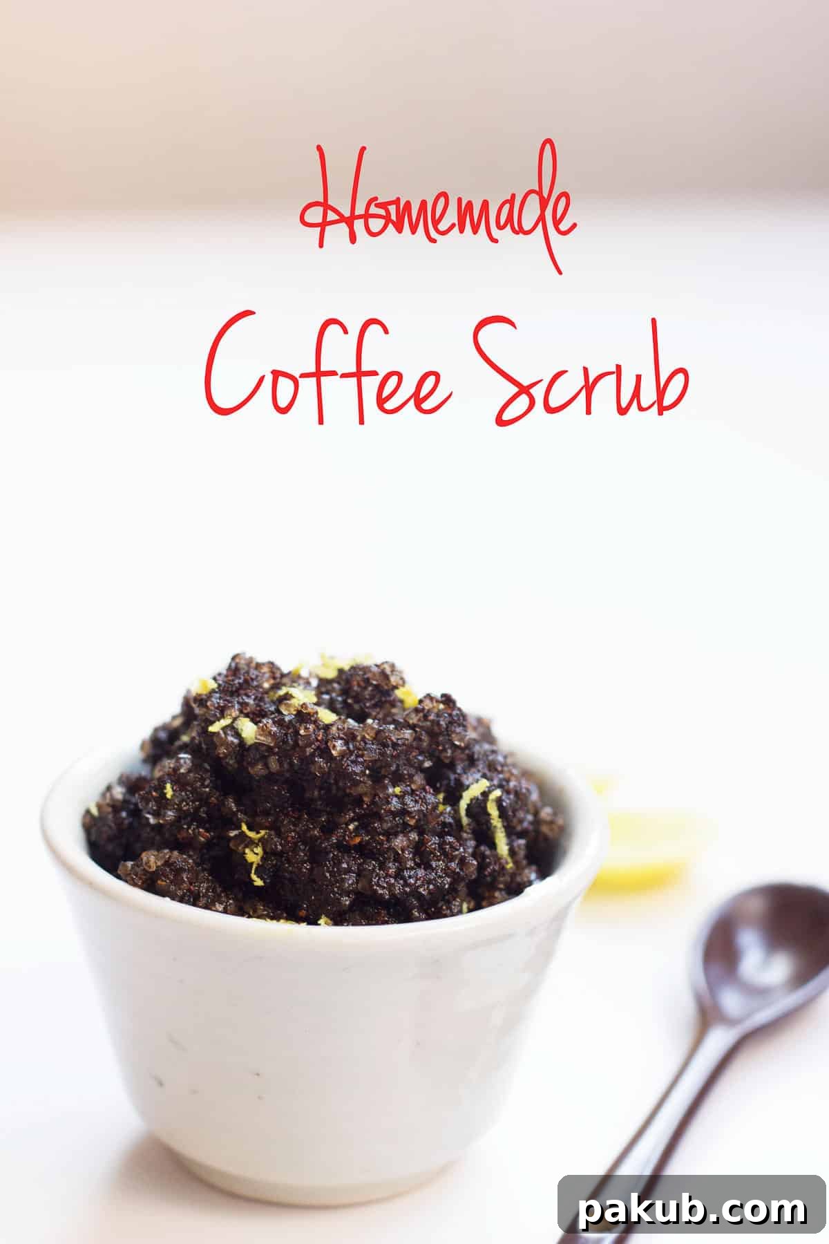 A close-up of a jar of DIY Homemade Coffee Scrub with fresh lemon slices, highlighting its natural ingredients.