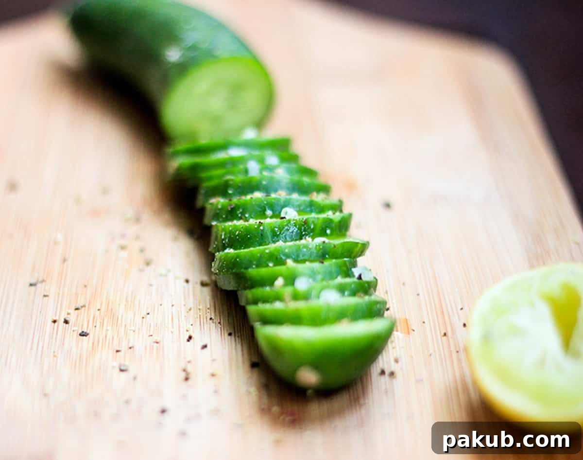 Fresh, green cucumbers, a key ingredient for the Sparkling Cucumber Chili Gin cocktail.