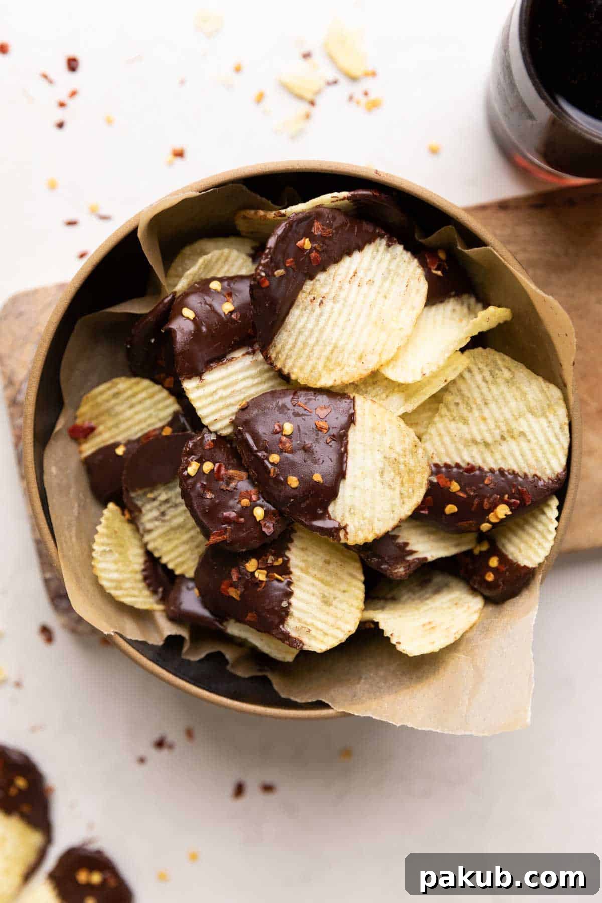 A beautiful bowl of homemade Chili Chocolate Covered Potato Chips, showcasing the perfect blend of sweet, salty, and spicy in a delightful snack.