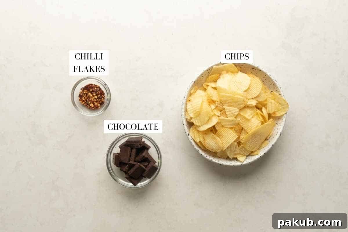 A detailed shot of the essential ingredients needed to create delicious chilli chocolate covered potato chips, laid out on a clean surface.