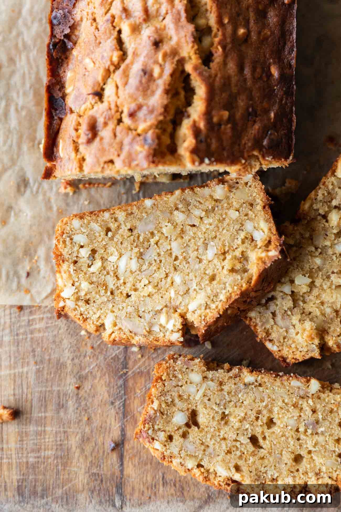 Caramelized Butter Banana Bread 7 A beautifully presented image of sliced Brown Butter Banana Bread, ready to be served, taken from a top-down perspective.