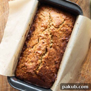 A picture of Brown Butter Banana Bread fresh out of the oven, golden brown and tempting.