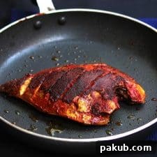 A picture of Mangalorean Chili, Salt and Vinegar Marinade + Fish Fry in a black pan.
