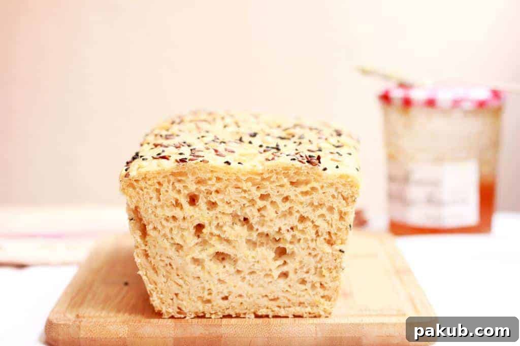 Homemade Multigrain Bread Texture A close-up shot of a homemade multigrain bread loaf, showcasing its rustic texture and healthy seeds, perfect for slicing.