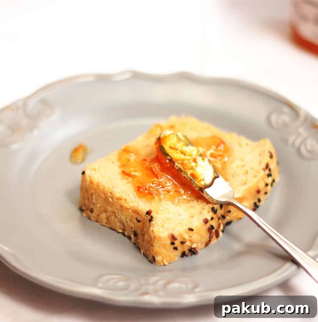 Multigrain Bread with Jam A perfect slice of homemade multigrain bread, lightly toasted and spread with jam, ready for a delicious breakfast.