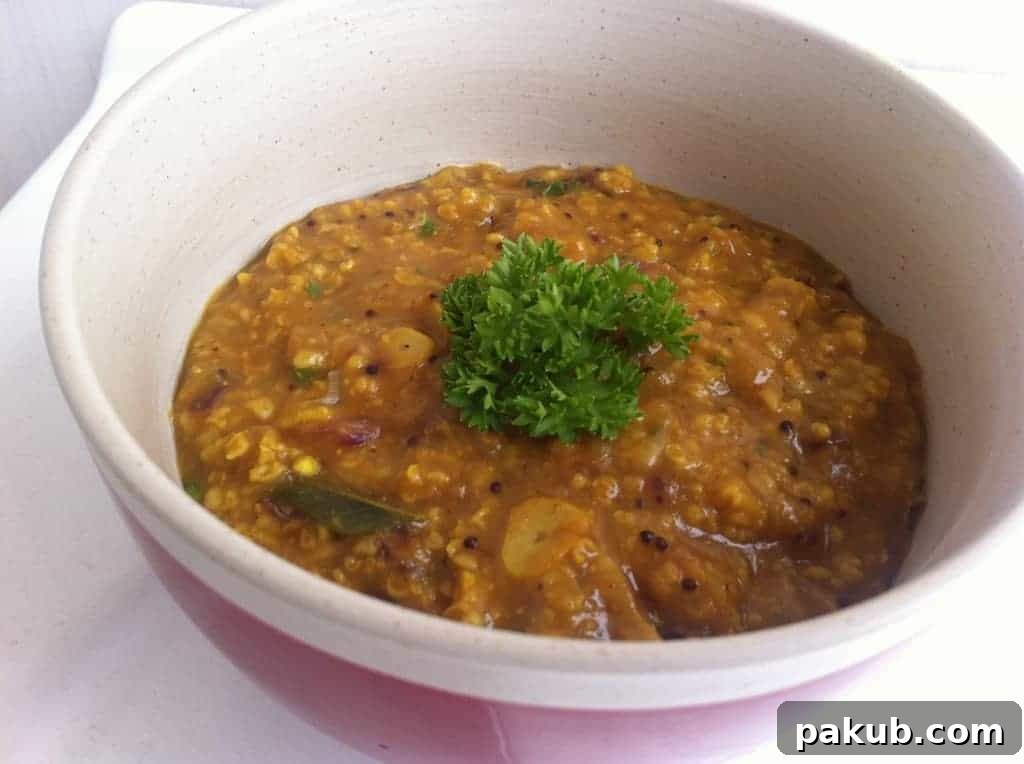 Oats Upma, a delicious savory Indian breakfast A steaming bowl of healthy Oats Upma, garnished with fresh coriander, signifying a comforting and nutritious Indian breakfast.