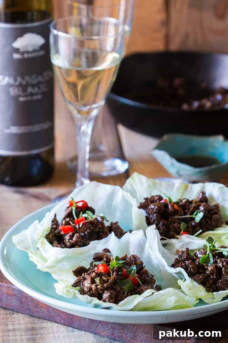 Easy, healthy and insanely delicious stir fried black bean chicken lettuce cups are perfect when you want dinner in 30 mins. This gluten free recipe features savory ground chicken and crisp lettuce.
