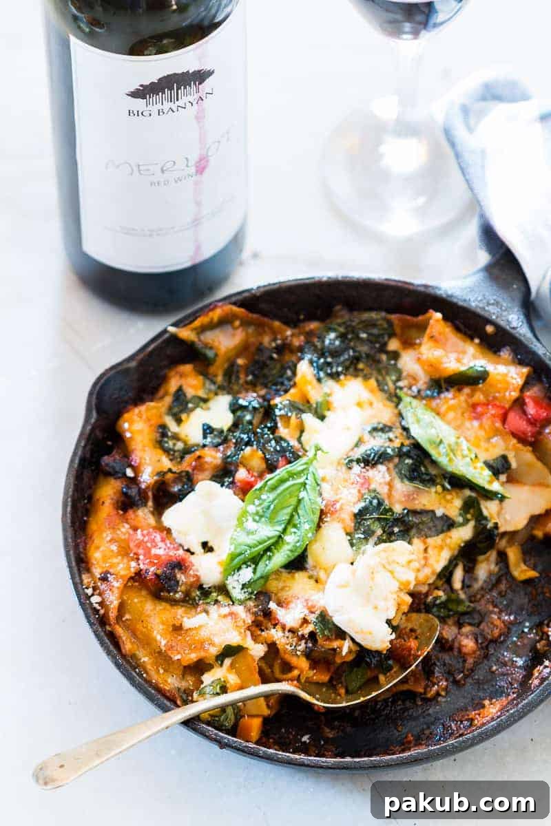 Easy 30-minute vegetarian lasagna skillet, a fast, healthy, and veggie-loaded one-pot meal perfect for quick dinners. Featuring rich pasta, gooey cheese, and fresh vegetables, it's ideal for serving from a cast iron skillet.