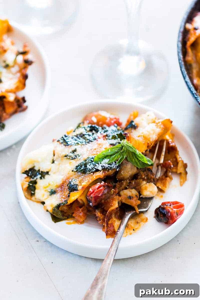 A vibrant close-up of the easy 30-minute vegetarian lasagna skillet, showcasing its rich red sauce, colorful vegetables, and melted mozzarella cheese. This healthy, one-pot dinner is perfect for a quick, satisfying meal.