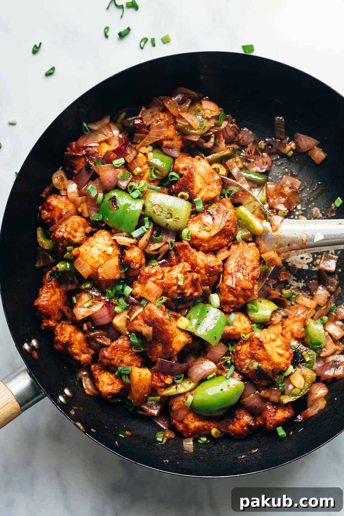 Easy Chinese Chilli Chicken Dry in a black wok.