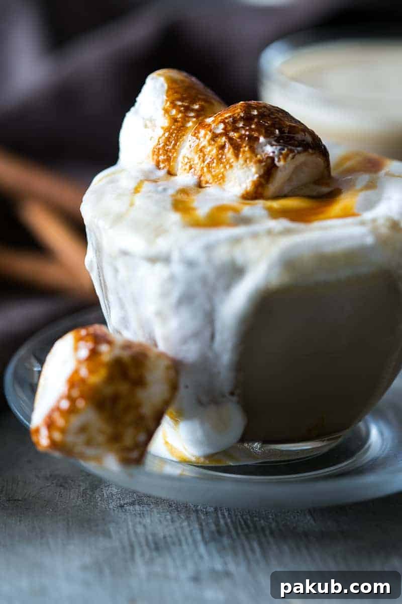 The best homemade butterbeer latte made with coffee, toffee and topped with toasted marshmallows. Just like the one you get at Starbucks!
