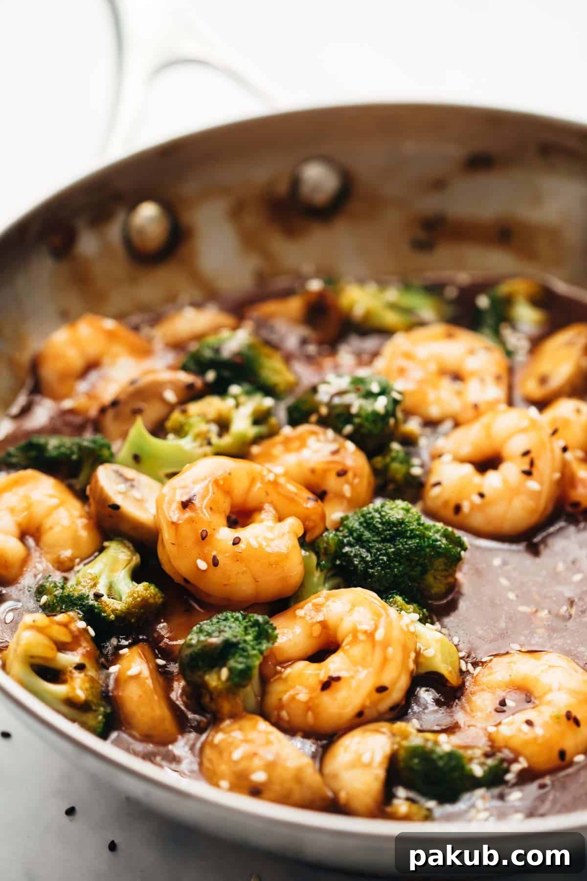 Fast Teriyaki Shrimp and Broccoli Stir-Fry 2 Teriyaki Shrimp Broccoli Stir Fry in a pan, showcasing succulent shrimp and vibrant green broccoli coated in a glossy sauce.