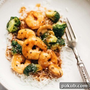Teriyaki Shrimp Broccoli Stir Fry served with steamed rice.