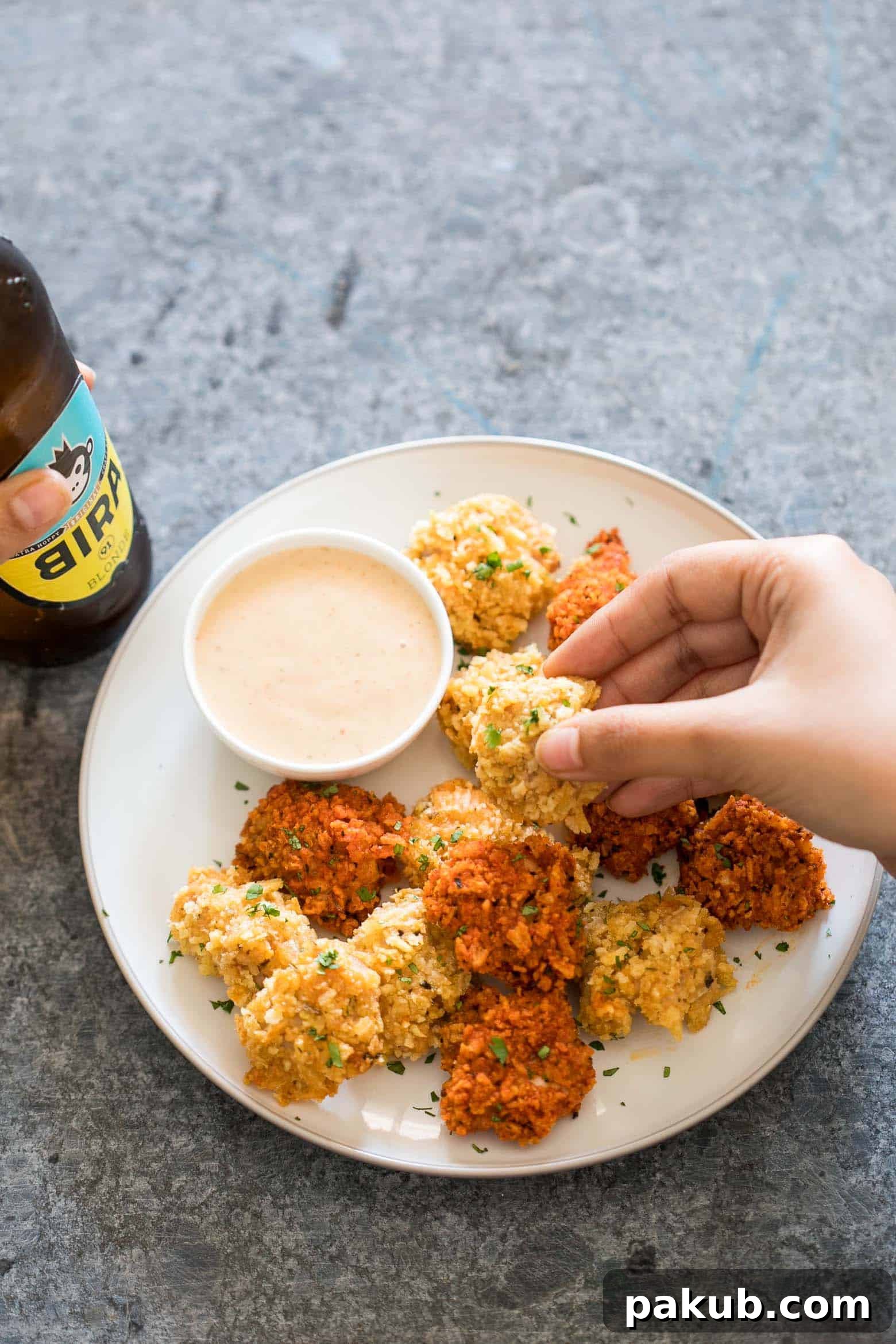 Baked Popcorn Chicken: KFC Flavor, No Fryer 2 The easiest recipe for baked popcorn chicken that can be made two ways - spicy and non spicy! Tastes KFC style, but gluten free and guilt free for the perfect party appetizer.