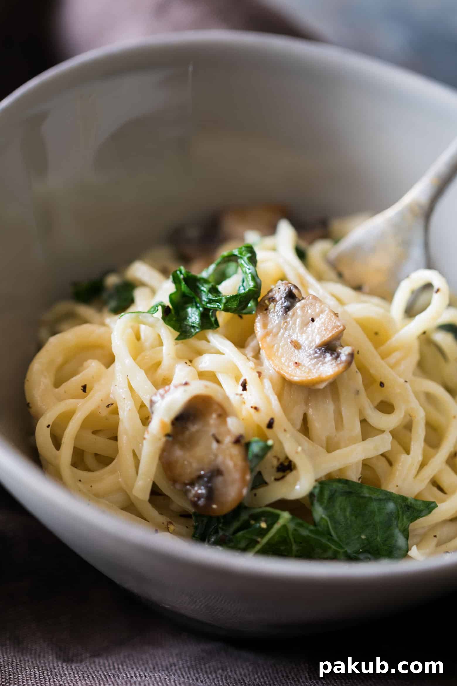 Lemon Kissed Mushroom Kale Linguine 5 A close-up of the creamy lemon mushroom kale linguine pasta, highlighting its rich texture and ingredients.