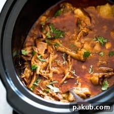 Chipotle pulled pork in a slow cooker.