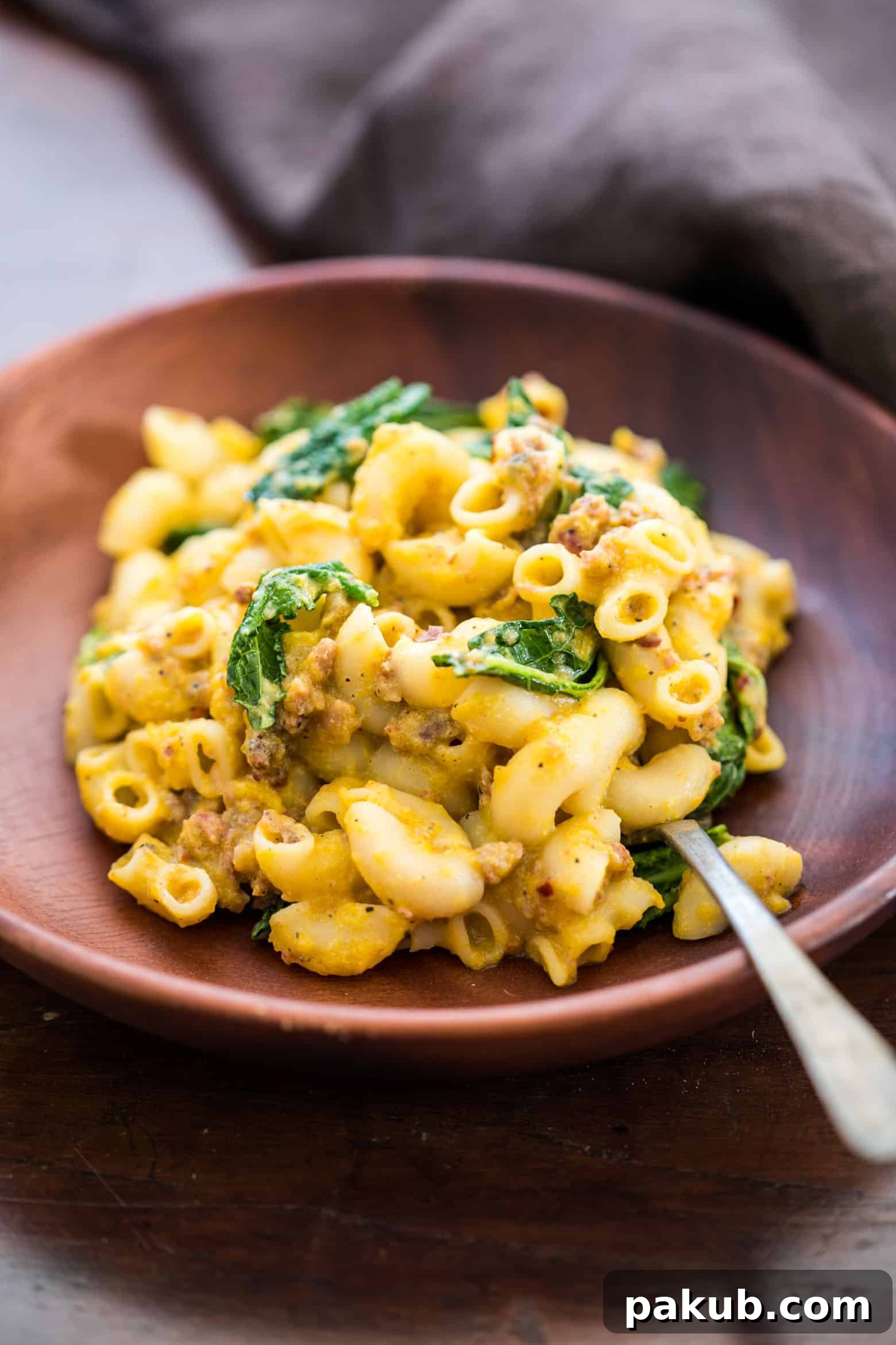 Cozy Fall Mac and Cheese with Pumpkin Sausage and Kale 3 Creamy pumpkin sausage mac and cheese with kale is pure comfort food! It's a fast, easy dinner recipe when you crave homemade pasta