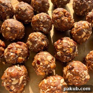 A close up of Gond Ke Laddu showing the perfectly shaped spheres with visible nuts and edible gum
