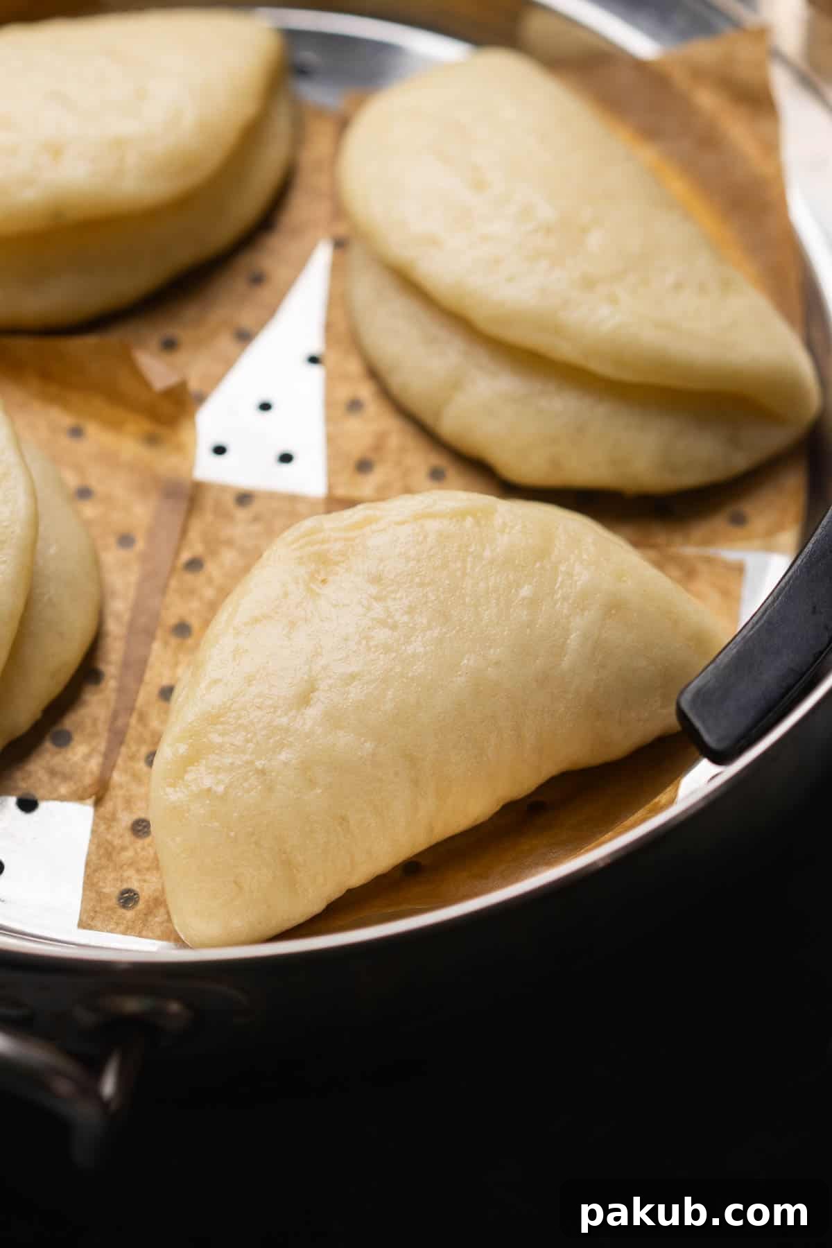 close up image of steamed bao buns to showcase their texture