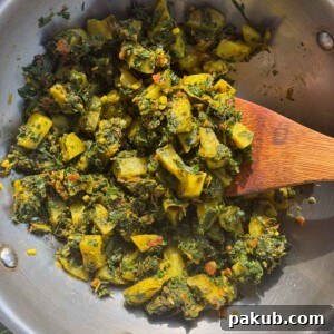 Close-up of a rustic bowl of Methi Aloo, showcasing texture and ingredients