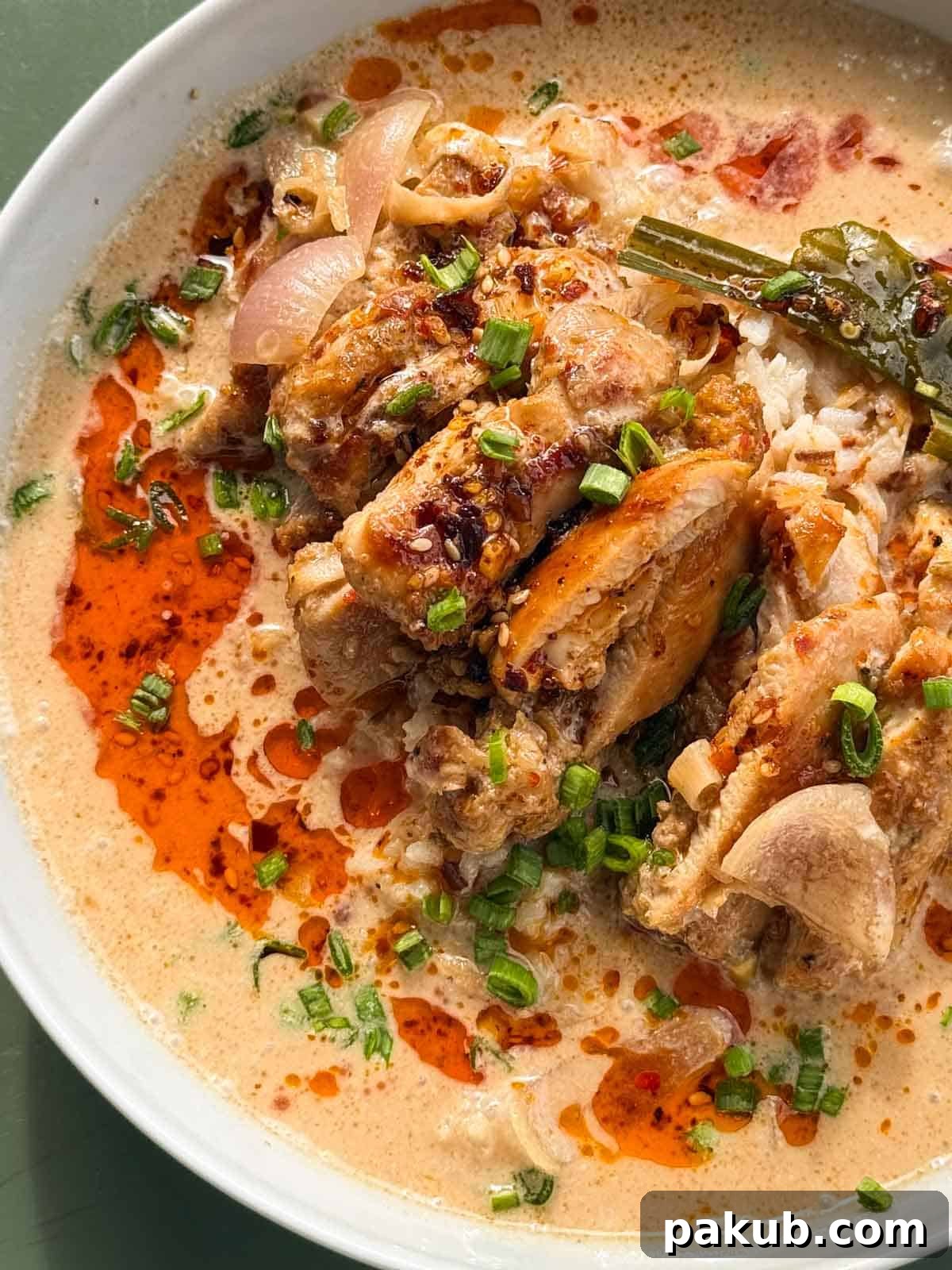 Another view of the delicious Lemongrass Chicken with Coconut Soup, highlighting its rich texture and enticing presentation.