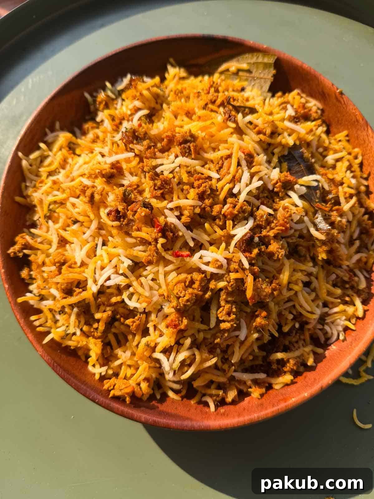 Plant-Based Soya Keema Biryani 2 A perfectly portioned bowl of Veg Soya Keema Biryani, showcasing its rich colors and textures, ready to be enjoyed.
