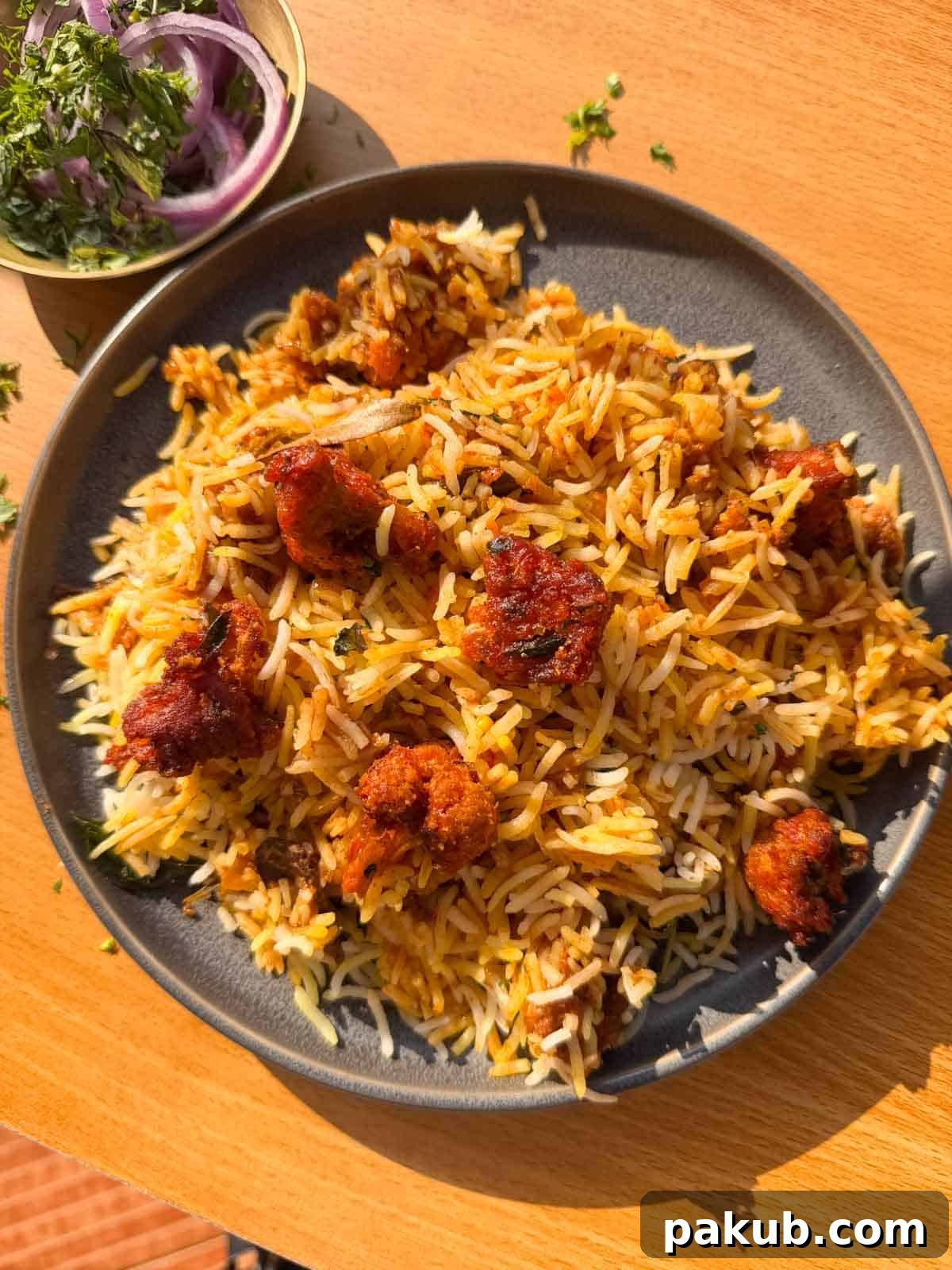 Crispy Cauliflower 65 Biryani 2 gobi 65 biryani served on a plate