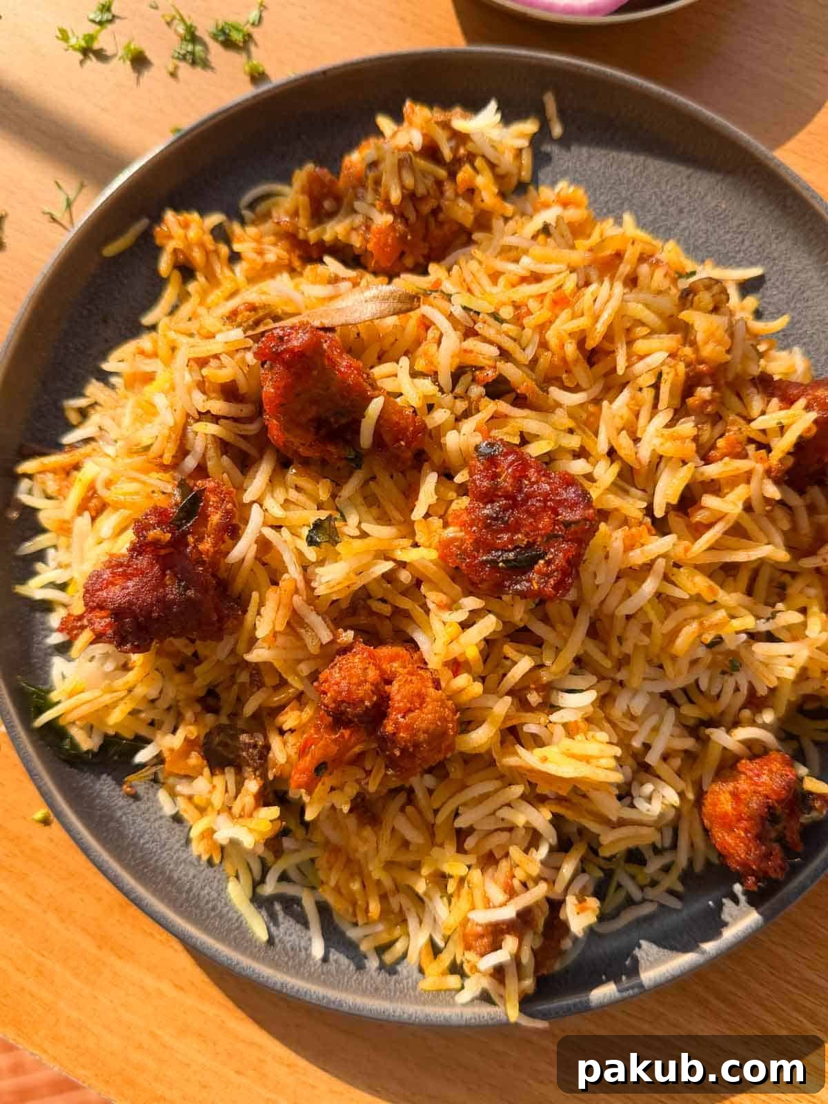 Crispy Cauliflower 65 Biryani 4 gobi 65 biryani served on a plate