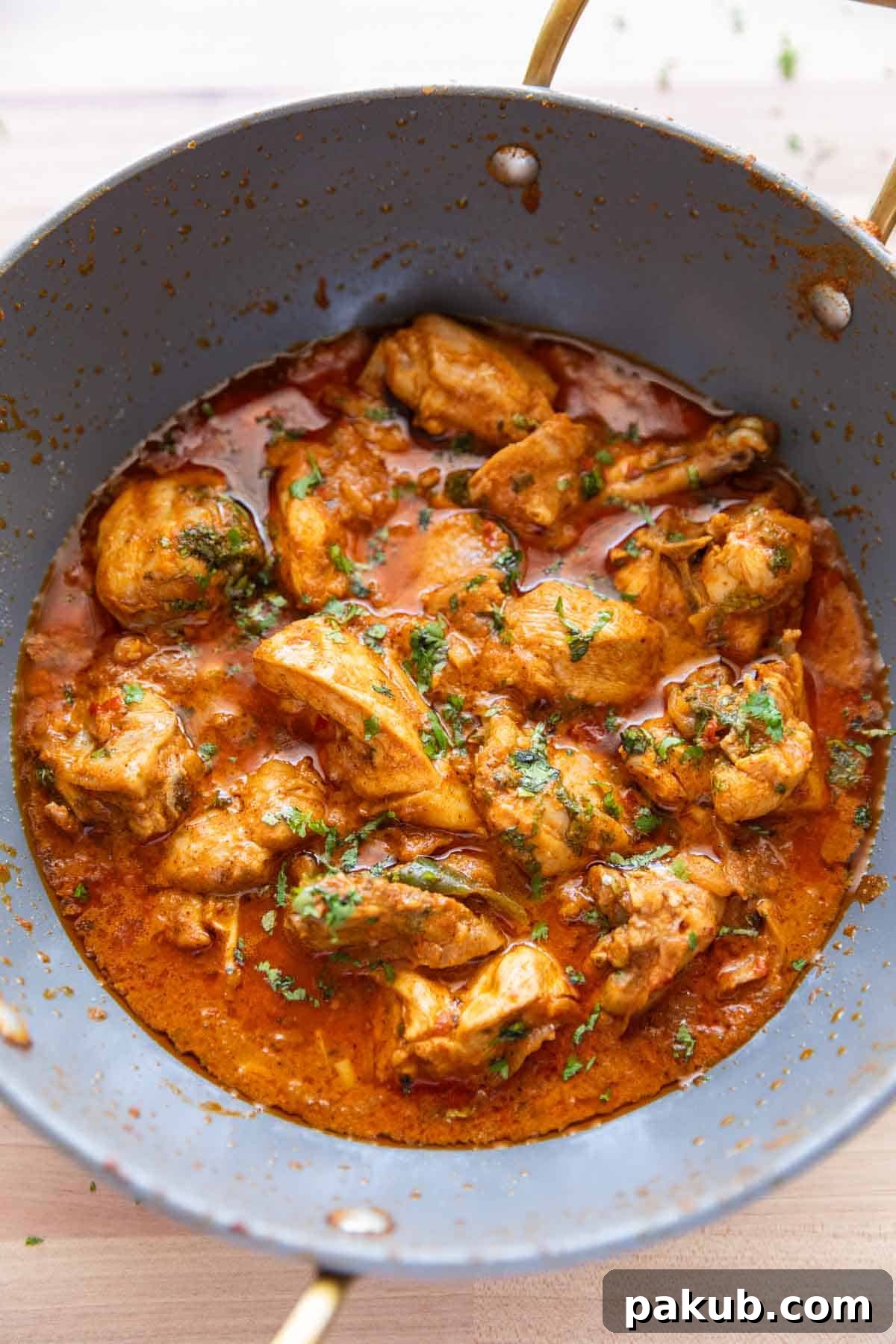 Dahi chicken pictured in the kadhai its cooked in