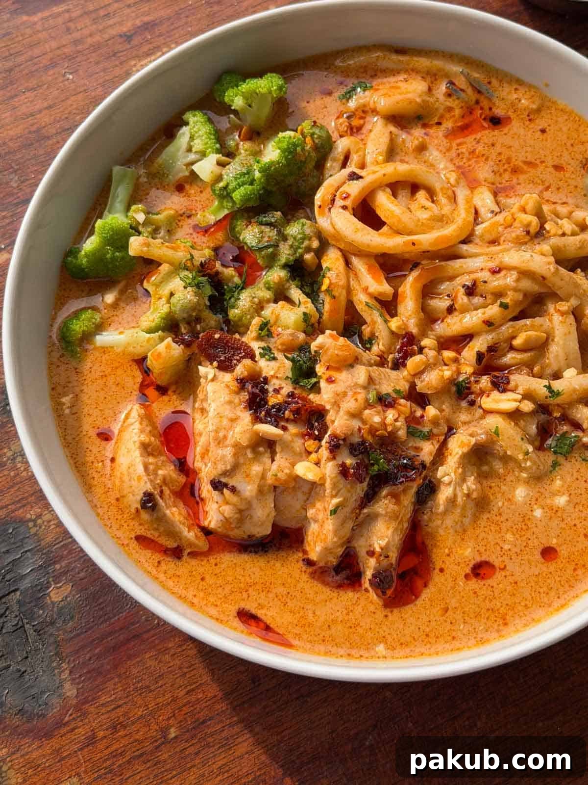 a close up image of peanut butter ramen noodles to showcase its color and texture