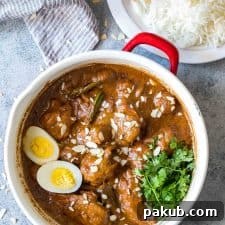 Mughlai Chicken garnished with coriander and boiled eggs.