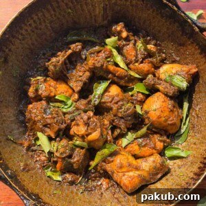 an image of curry leaf chicken in the cooking vessel