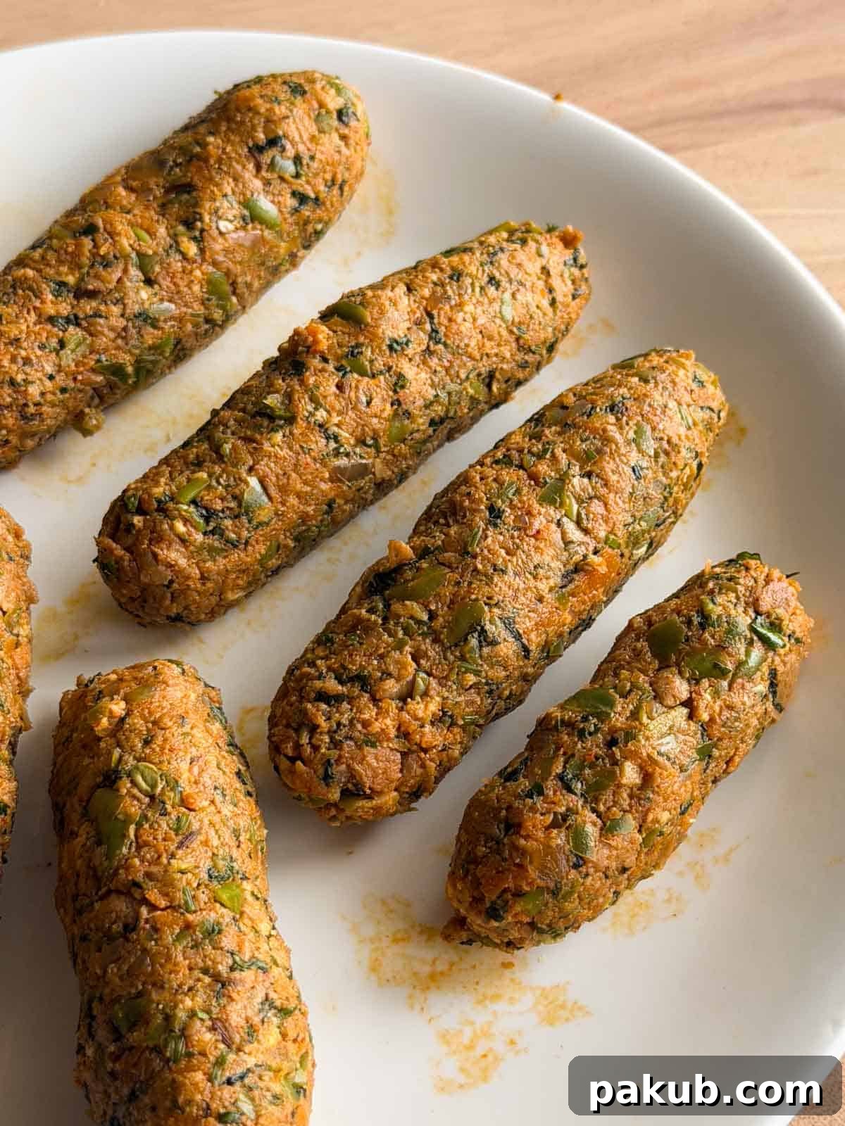 High-Protein Vegetarian Seekh Kebab Recipe for Muscle-Building 3 shaped veg seekh kebabs ready to be fried