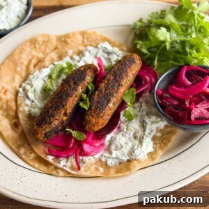 High-Protein Vegetarian Seekh Kebab Recipe for Muscle-Building 6 an image of veg seekh kebabs served on a roti with accompaniments