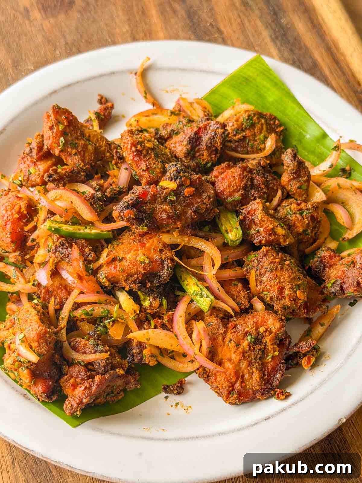 Air Fryer Chatpata Chicken Bites: Crisp Tangy Flavor 3 an image of chicken bites served on a white plate