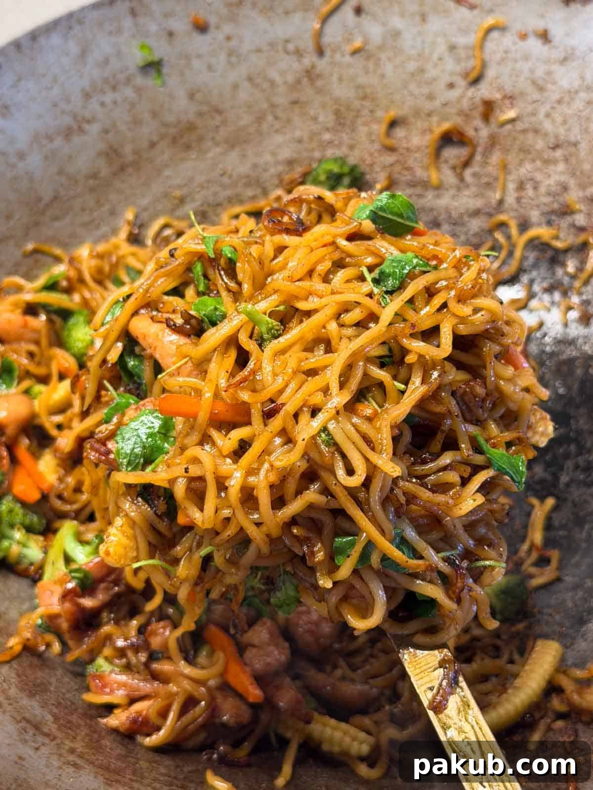 Authentic Thai Drunken Noodles (Pad Kee Mao) Recipe 2 close up image of Thai drunken noodles in the wok it was cooked in