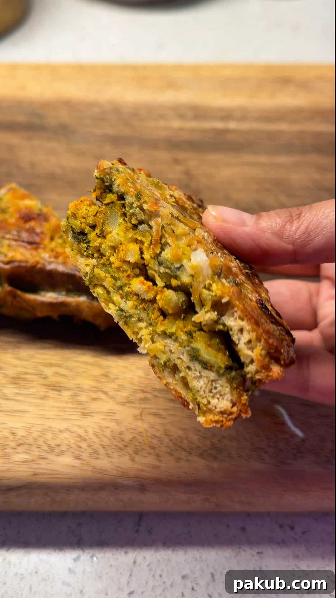 Crispy Air Fryer Bread Pakoras 3 an air fryer bread pakora cut in half to show it's filling