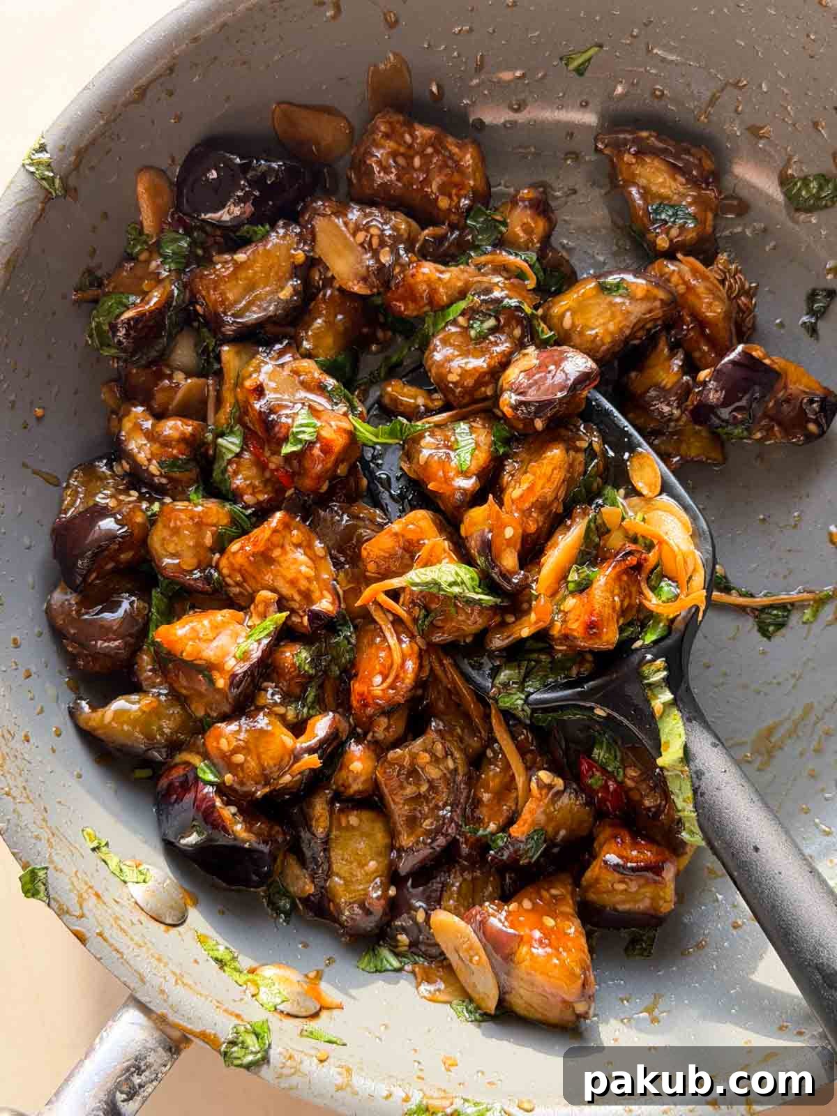 Crispy Thai-Style Eggplant Made in the Air Fryer 3 air fryer thai eggplant in the frying pan with spoon
