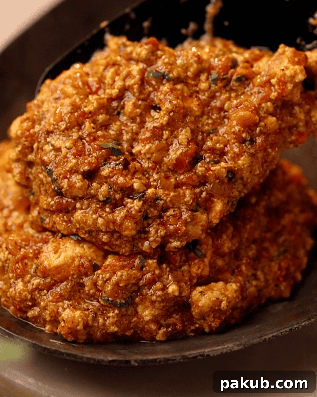 a close up shot amritsari paneer bhurji being served on a plate