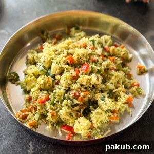 thecha paneer fried rice served in a steel plate