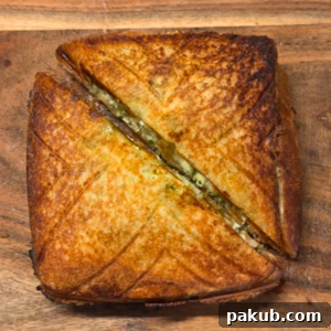 thecha paneer sandwich cut in half and ready to be served