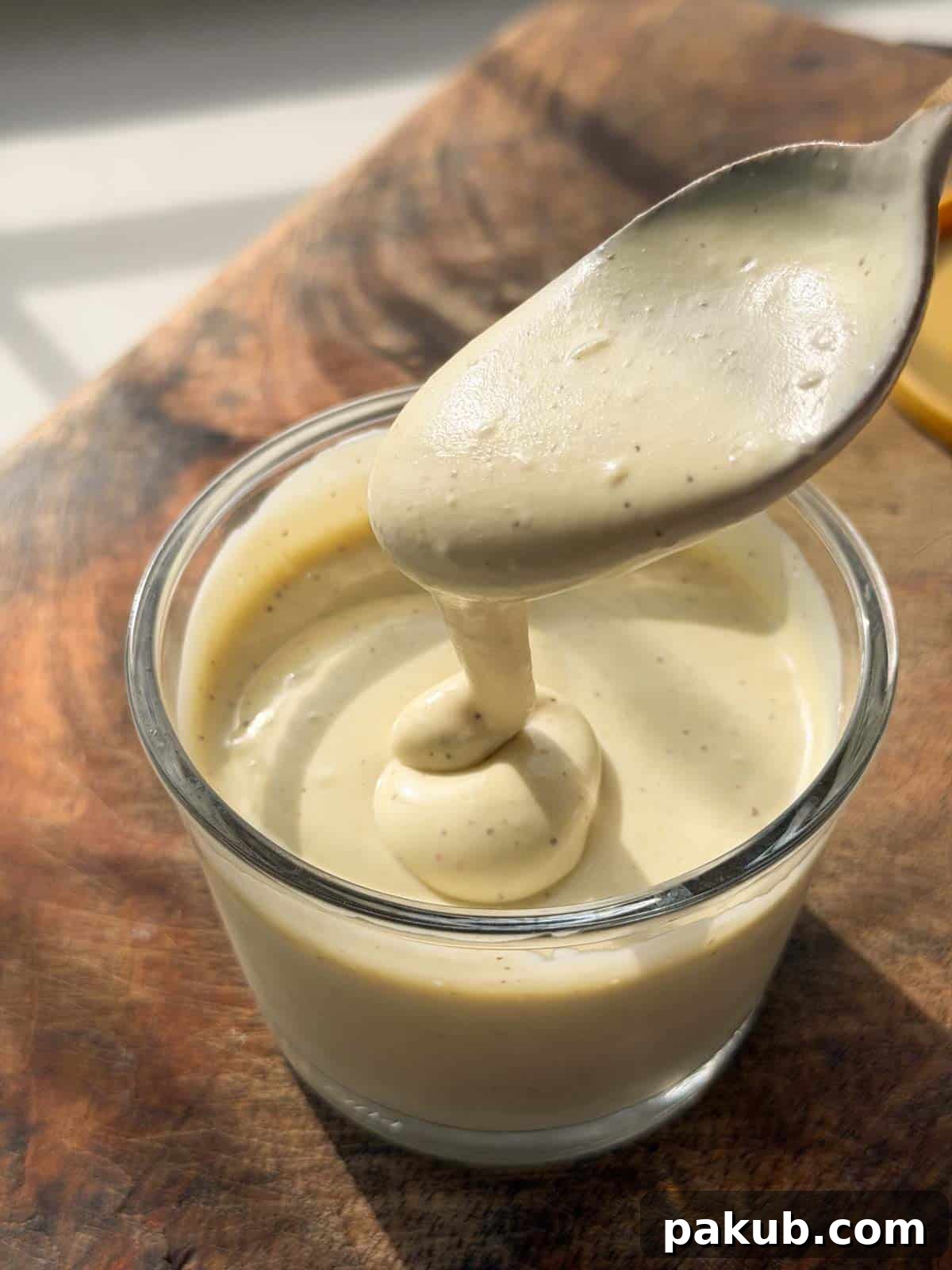 Protein-Packed Egg-Free Veggie Mayonnaise 4 smooth and creamy veg mayo scooped up in a spoon